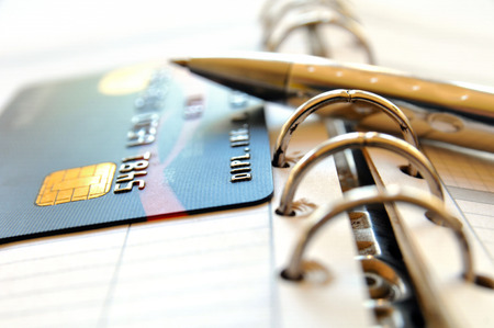 Credit card and ball pen on a organizer の写真素材