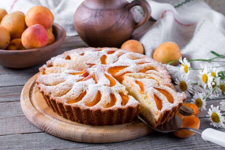Apricot pie on wooden tableの写真素材