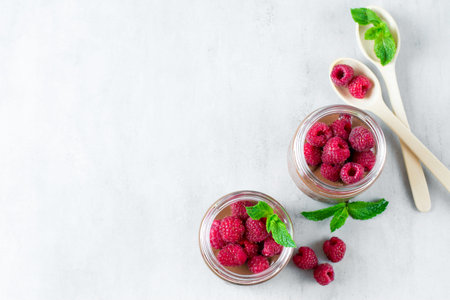 Chocolate dessert with raspberries on a grey concrete, stone or slate background.Top view with space for text.の写真素材