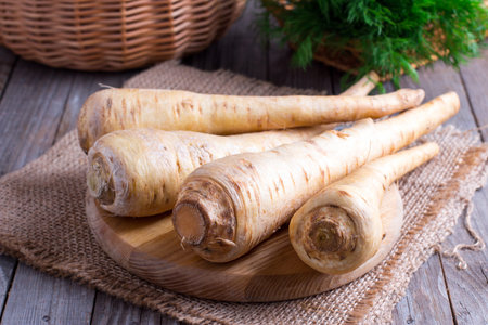 Fresh parsnip on wooden tableの写真素材