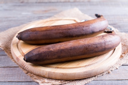 Ripe bananas on a cutting boardの写真素材