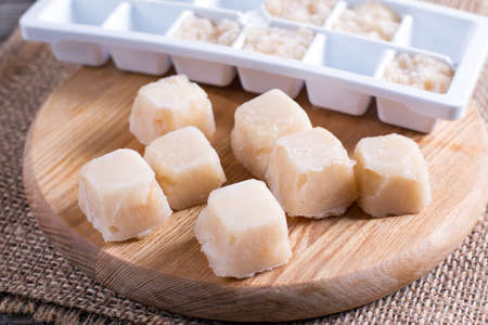 Frozen pear puree on a cutting boardの写真素材