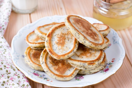 Homemade pancakes with poppy seeds on plate for tasty healthy breakfastの写真素材