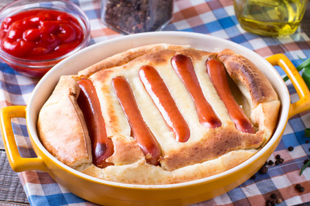 Delicious toad in the hole into a baking dish close up on the table. horizontalの写真素材