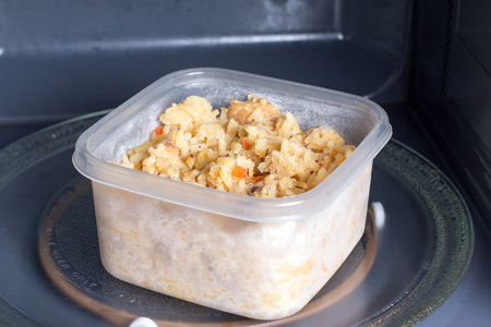 Frozen food in the in the microwave, food is ready to be heat in microwaveの写真素材