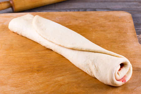 Cooked round cake made from yeast dough with jam, horizontalの写真素材