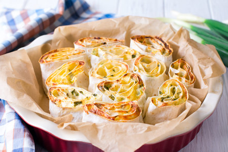 Rolls with cheese and greens. Thin Armenian pita bread or lavash. Snack.