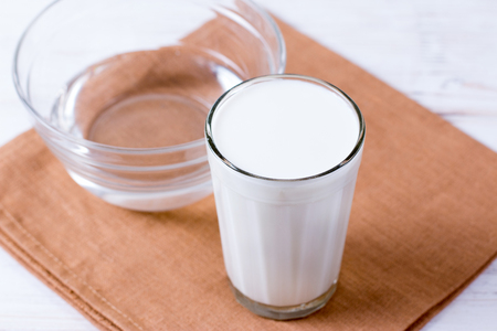 Glass kefir (milk) on a wooden background. The concept of diet, weight loss.の写真素材