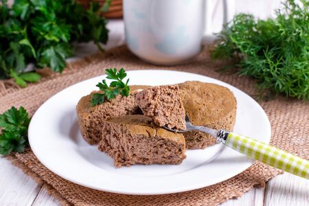 Liver souffle in a white bowl on the table. Children's recipes.の写真素材