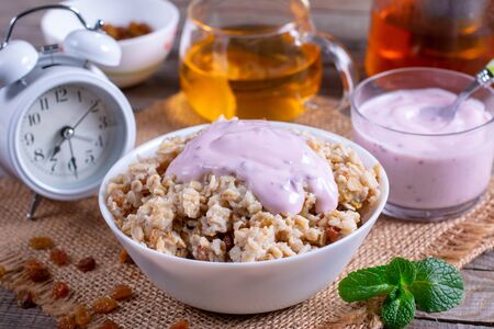 Healthy Breakfast Oatmeal Porridge Bowl with yoghurt. Healthy eatingの写真素材