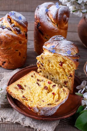 Traditional easter cake craffin (kraffin) with powdered sugar on the table. Easter cakes and...