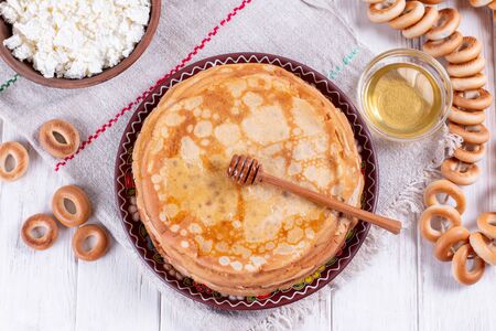 Stack of thin pancakes with honey. Russian bliny. Maslenitsa.の写真素材