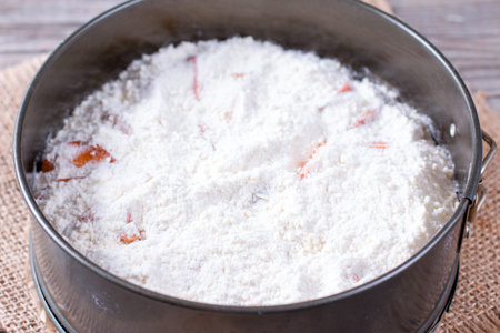 Flour and sugar in a baking dish. Making bulk cake