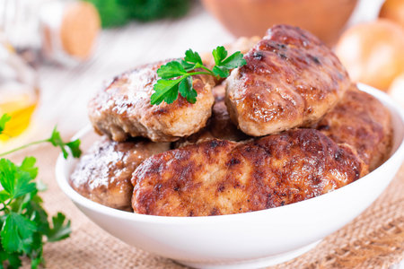 Fresh cutlets on plate on a table on a table