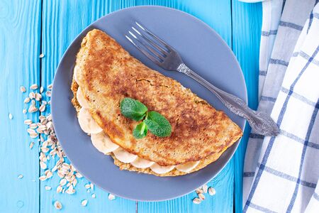 Delicious banana oatmeal pancake on a plateの写真素材