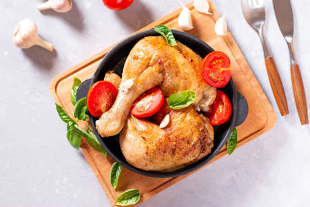 Chicken Legs with garlic on bright gray background, horizontal. Top view.の写真素材