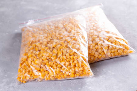 Frozen vegetables on the table. Frozen sweet cornの写真素材