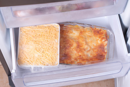 Container with food in the freezer. Healthy foodの写真素材
