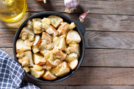 Baked in the oven potatoes with cheese. Top view. Place for text. Copy space.