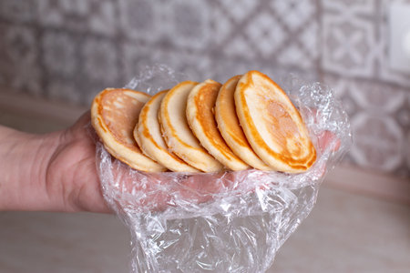 Frozen pancakes in hand. Ready frozen food, healthy foodの写真素材