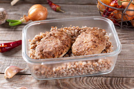 Ready meals. Cutlets and buckwheat in a container ready for freezingの写真素材