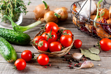 Cocktail tomatoes on wooden background. Ingredients for cooking.