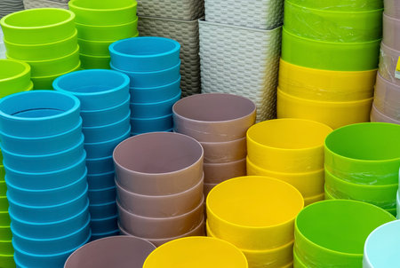 Pots of flower pots on the shelf in the store. Colorful pots