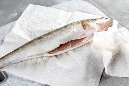 Fresh peeled fish ready to cook. Fresh pike perch in a plateの写真素材