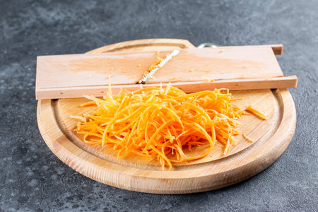 Grated carrots for making a spicy salad with bell peppers, carrots, vegetables and sesame seeds....
