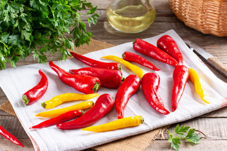 Chili pepper preparation before freezing on a wooden board on the table. Frozen food. Frozen...