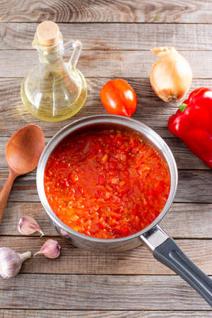 Step by step cooking Ratatouille. Ratatouille casserole on a wooden table. Provencal vegetable dish. Dieting, vegan food. Ratatouille casserole.の写真素材