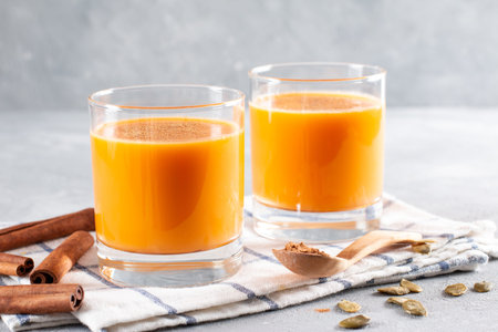 Vegetable milk from pumpkin seeds in a glass on a light background, horizontal