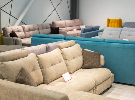 Furniture store with sofas and couches on display for sale, copy space. Showroom in the upholstered...