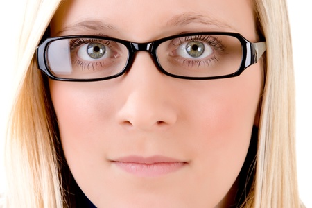 Portrait of smiling blond haired teenager in trendy glasses or spectacles, white background.の写真素材