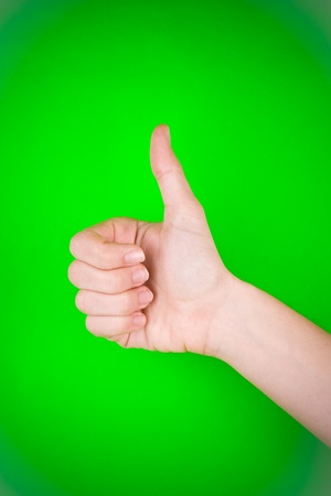 A closeup of a hand, giving the thumbs up.の写真素材