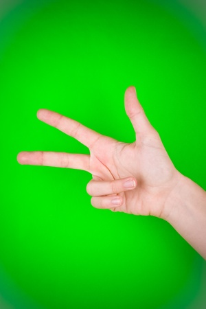 Human hand as if counting the number three.の写真素材