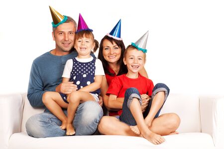 Happy family . Father, mother and children celebrating birthday at homeの写真素材
