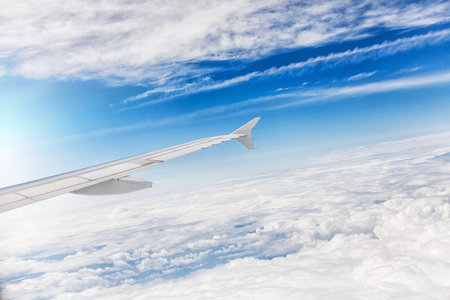 Aircraft wing some component of plane on during flying high above sky 