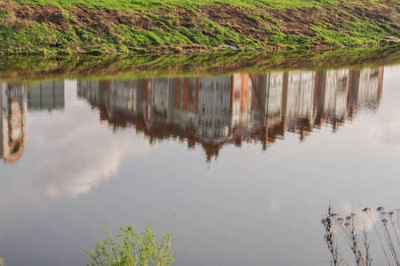 Reflection of houses in waterの写真素材