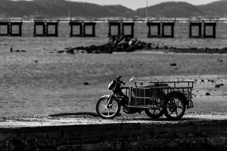 Pictures of the sea with mountains and motorbike