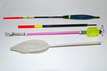 top view on fishing tackles with white backgroundの写真素材