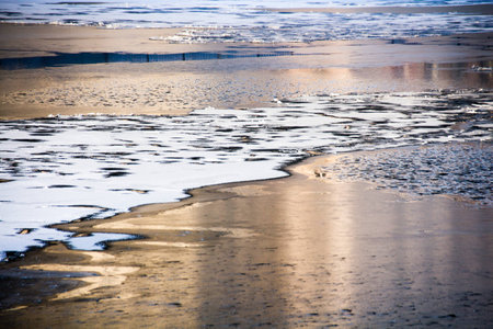 Frozen river and sunsetの写真素材