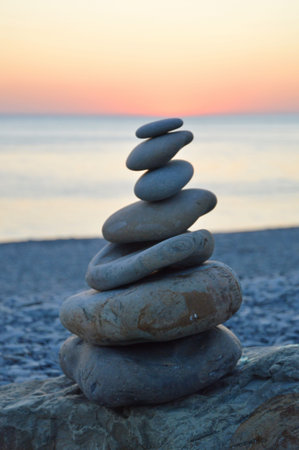 Tower of stones and sea background