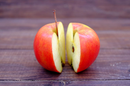 Sliced apples on the table view, wooden rustic food background