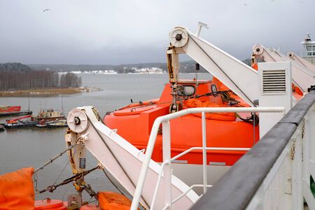 Lifeboats on the ship cruise, rescue sea boat orangeの写真素材