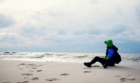 Man on the beach male, lonely, beard lookの写真素材