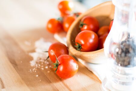 Red tomatoes on wooden top