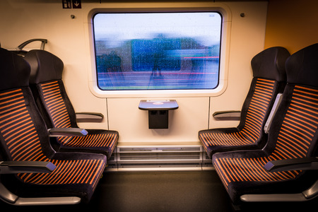 Inside modern train looking out of the window