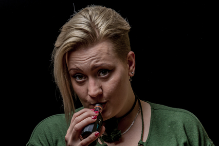 Woman inhaling from electronic cigaretteの写真素材