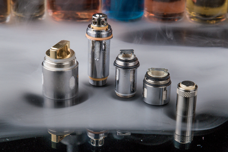 Electronic cigarette Clearomizer coils in smoke cloudの写真素材